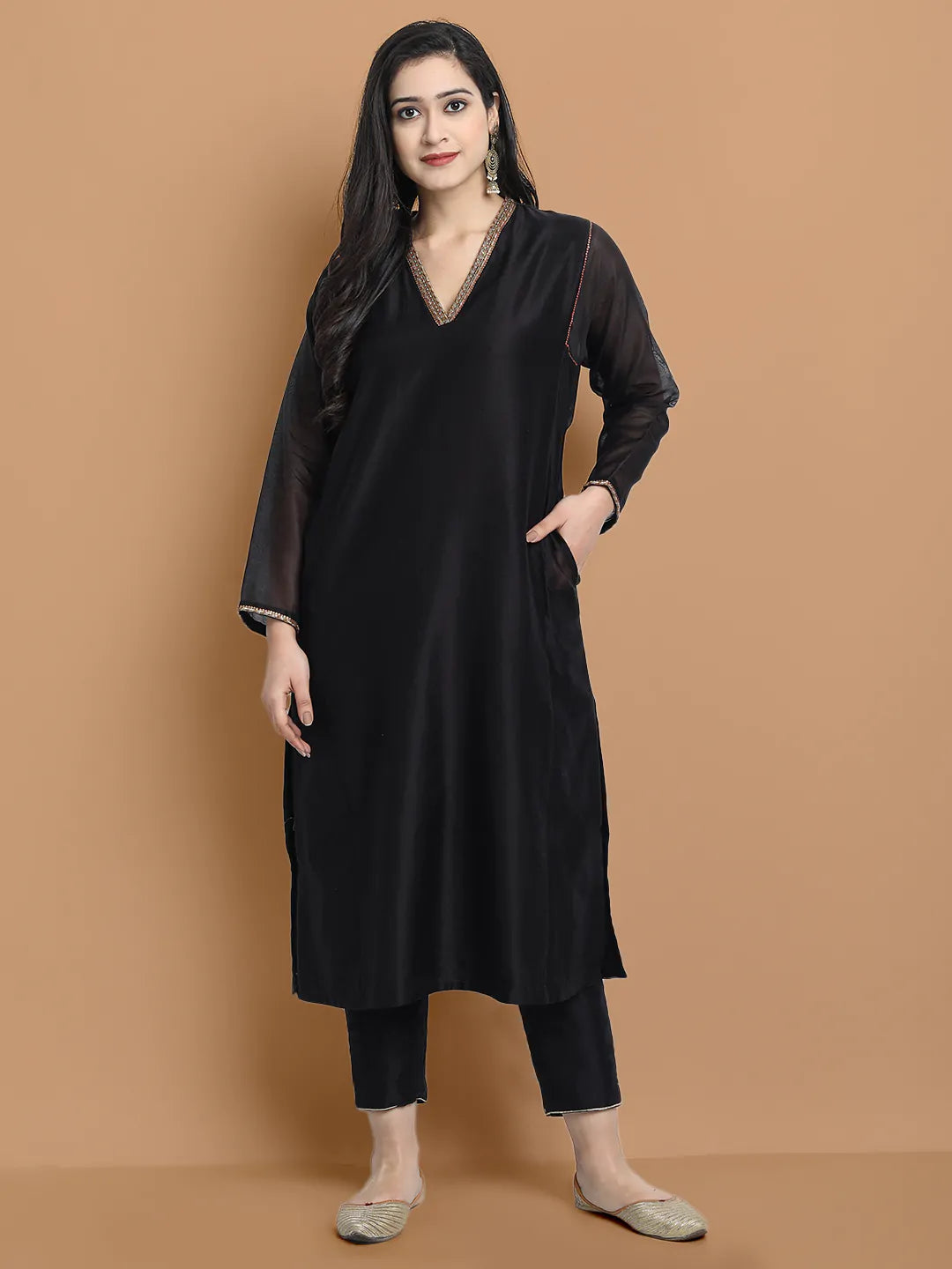 Yarn dyed chanderi kurta accentutated with hand embroidery at the neck area and armhole and cuff, paired with cotton pencil pant