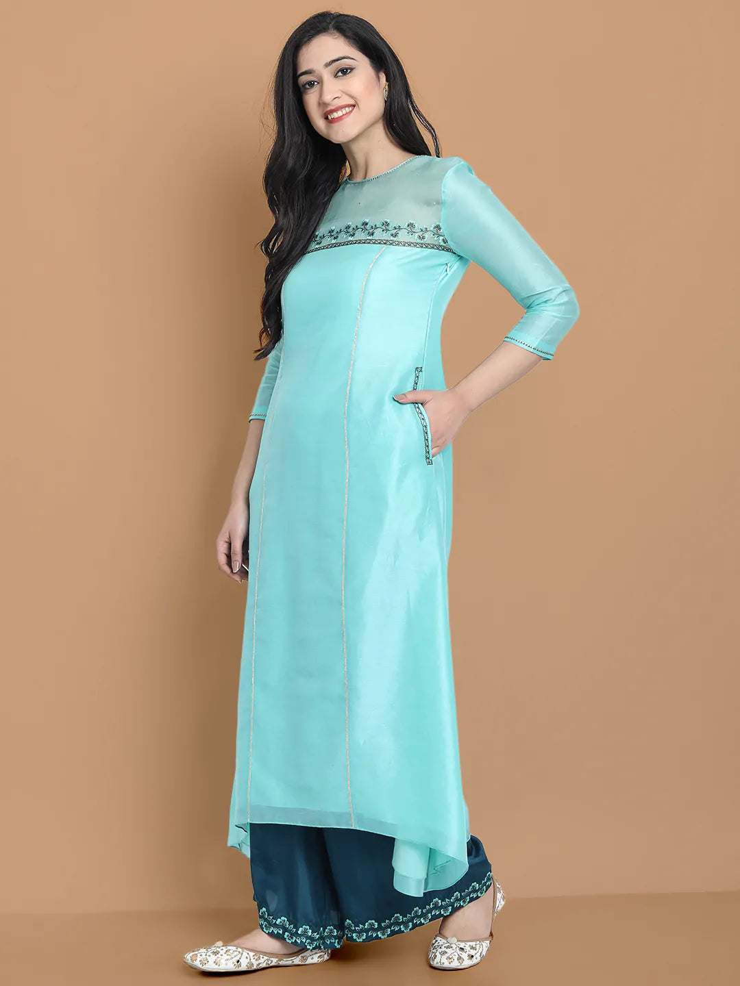 Pastel blue high low kurta with hand and machine embroidery , paired with embroidered wide farshi