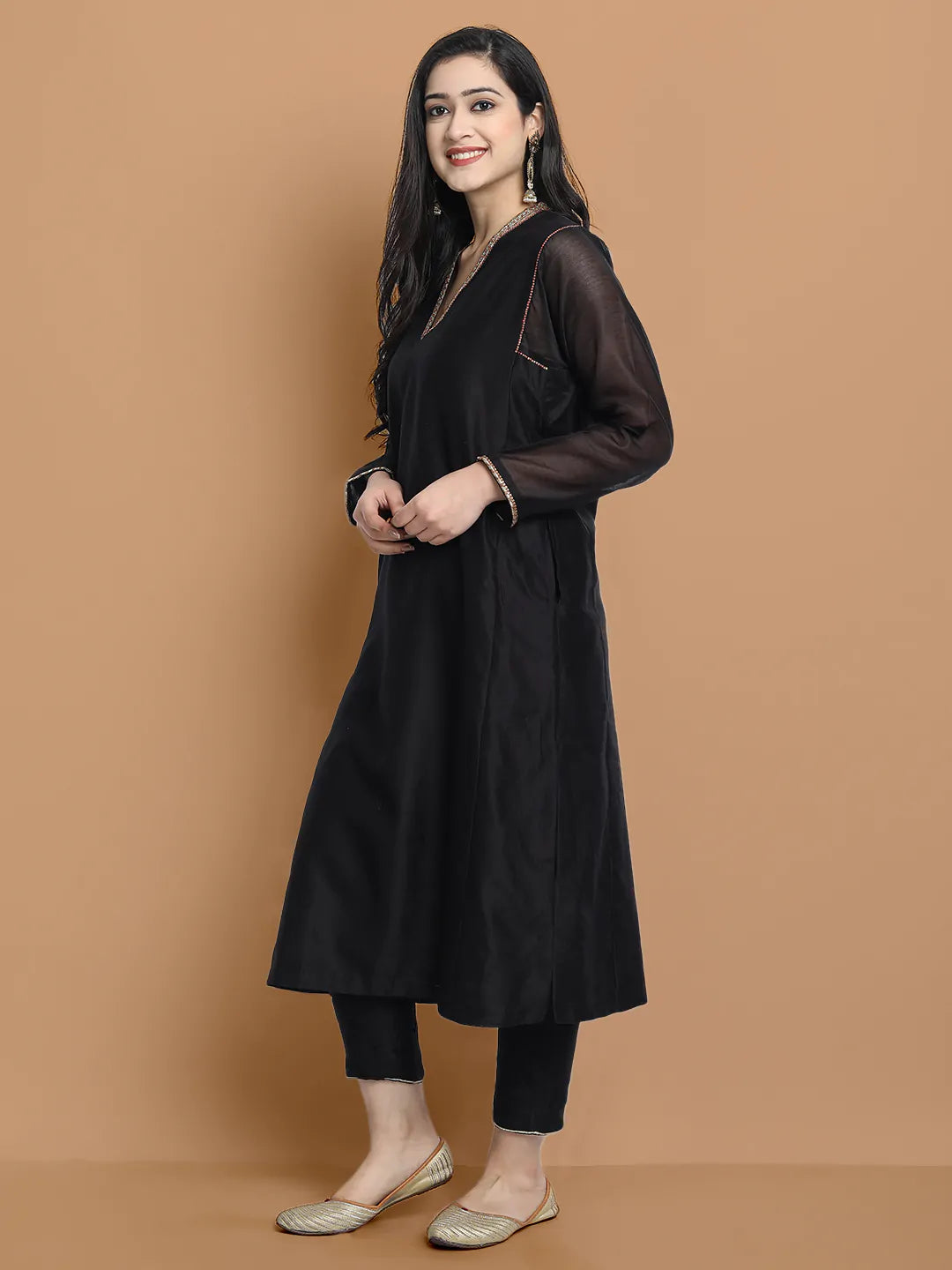 Yarn dyed chanderi kurta accentutated with hand embroidery at the neck area and armhole and cuff, paired with cotton pencil pant