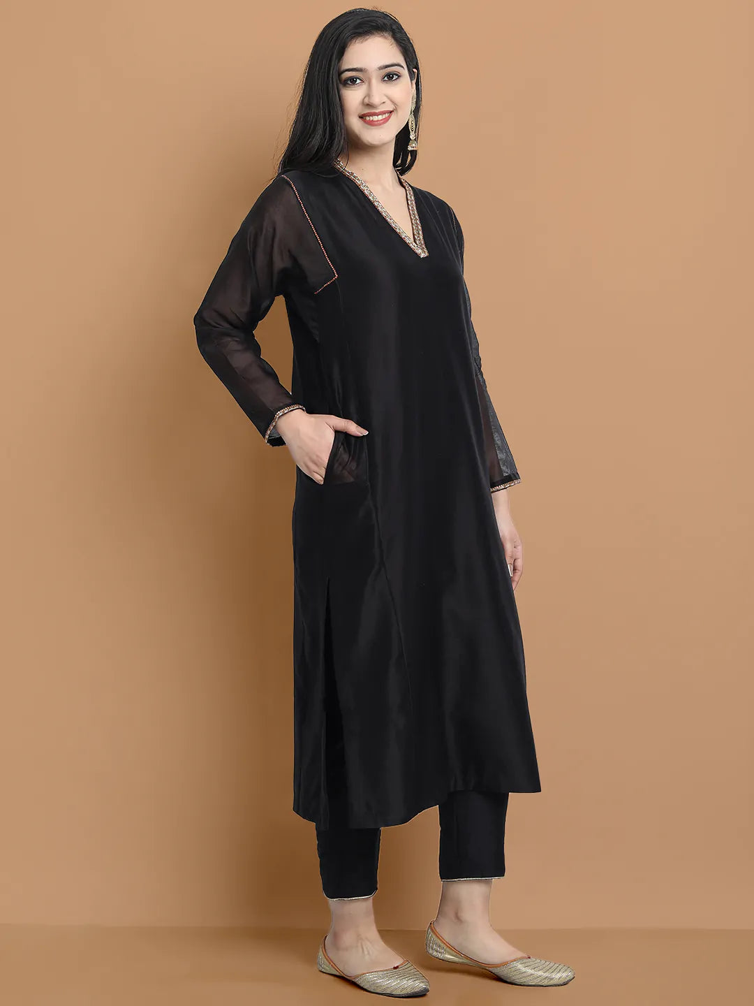 Yarn dyed chanderi kurta accentutated with hand embroidery at the neck area and armhole and cuff, paired with cotton pencil pant
