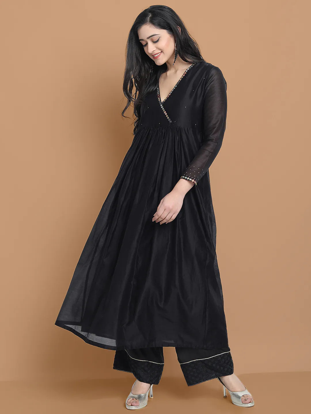 Black silk chanderi Dress Accentuated with Exquisite hand embroidery signifing beauty is in the detailing.