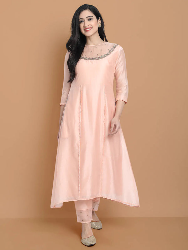 Yarn dyed chanderi kurta accentutated with hand machine embroidery on the textured shoulder yoke, paired with embroidered cotton trouser