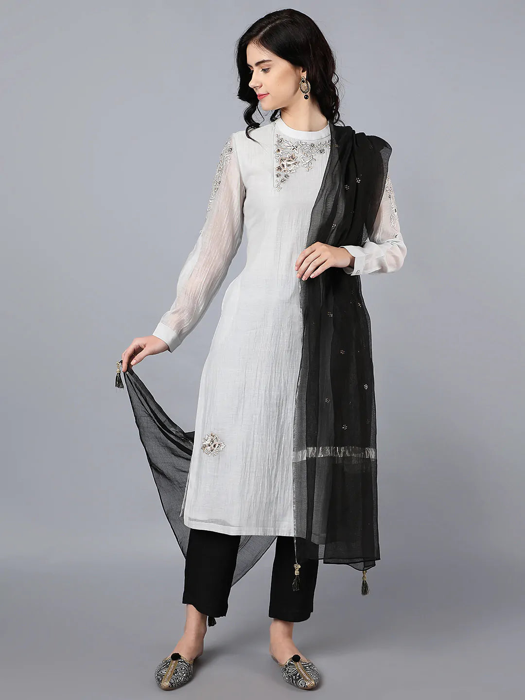 Chanderi kurta with resham and badla embroidery paired with chanderi pencil pants