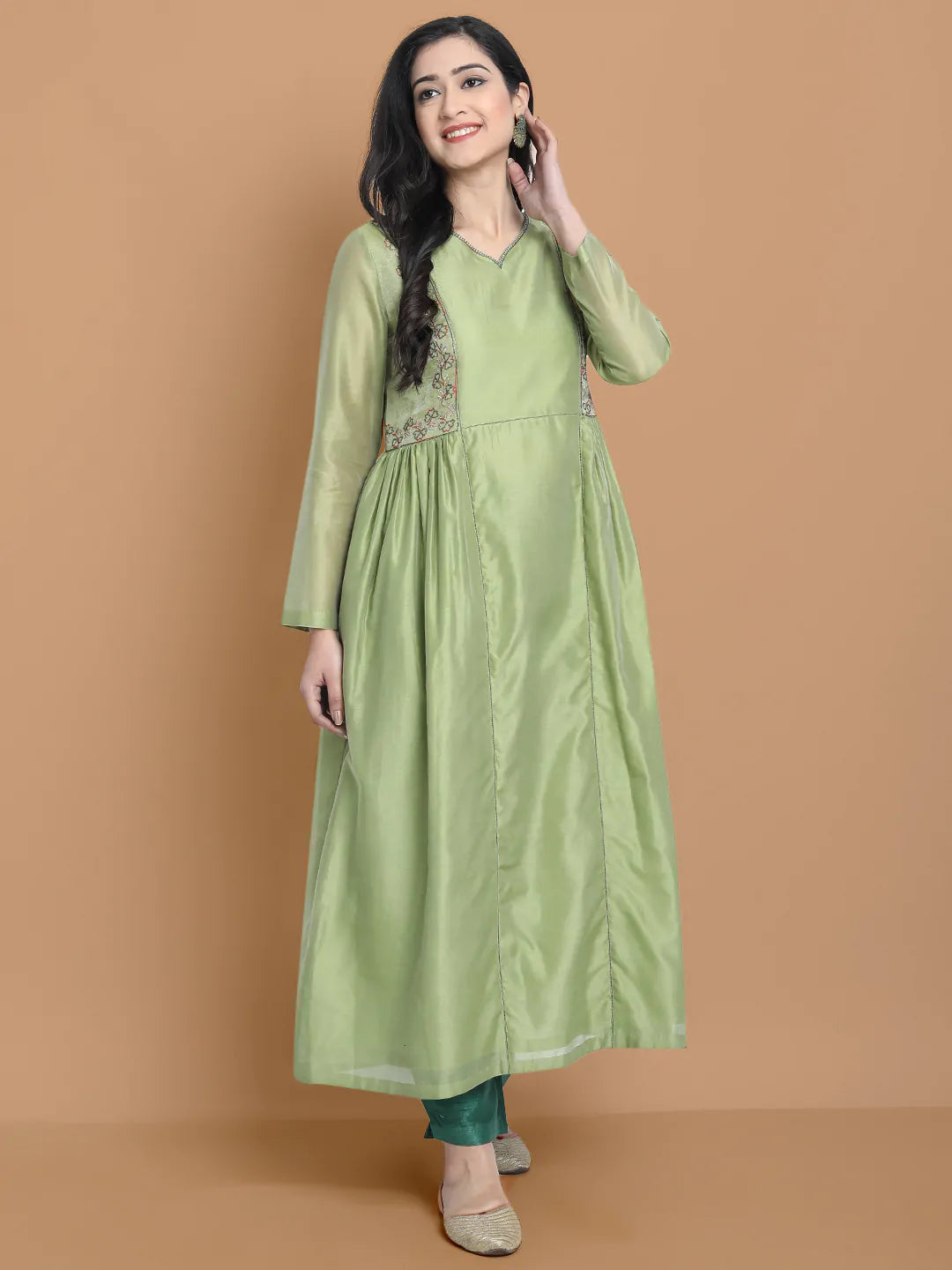 Light green silk chanderi kurta accentuated with exquisite hand embroidery and got emb at the neck , paired with cotton trouser
