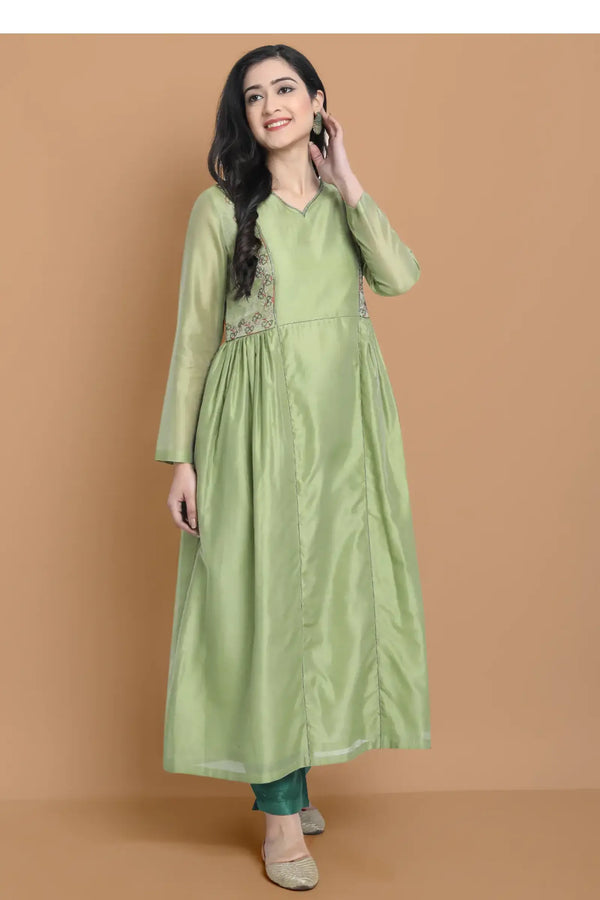 Light green silk chanderi kurta accentuated with exquisite hand embroidery and got emb at the neck , paired with cotton trouser