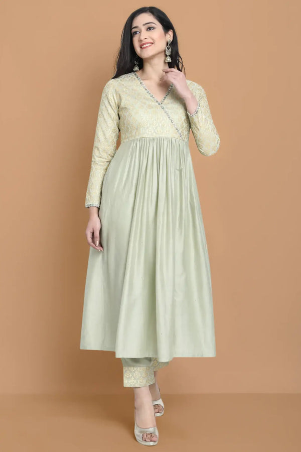 Hand embroidered dress made in combination with silk jacquard and silk chanderi , paired with bemberg cotton trouser