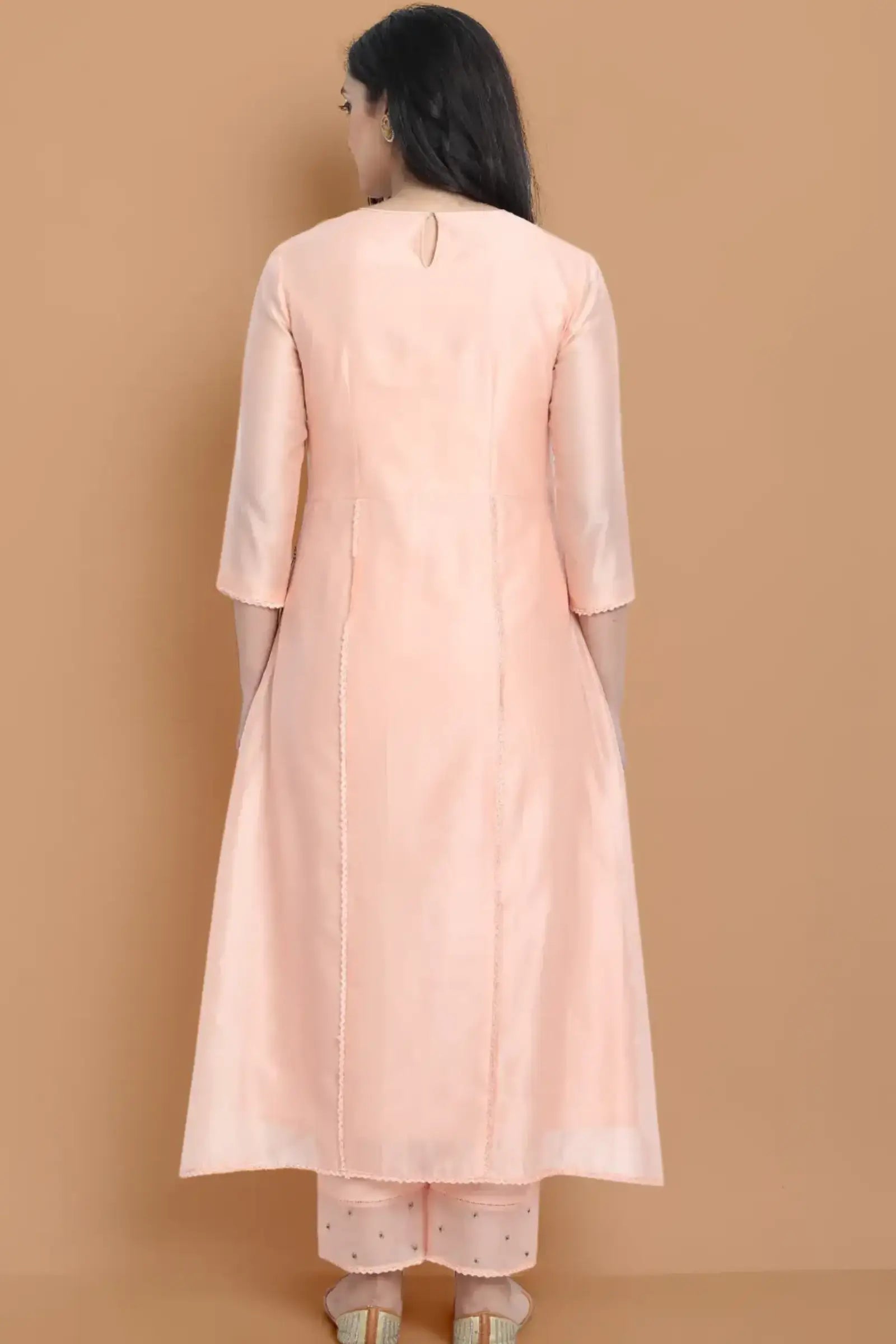 Yarn dyed chanderi kurta accentutated with hand machine embroidery on the textured shoulder yoke, paired with embroidered cotton trouser
