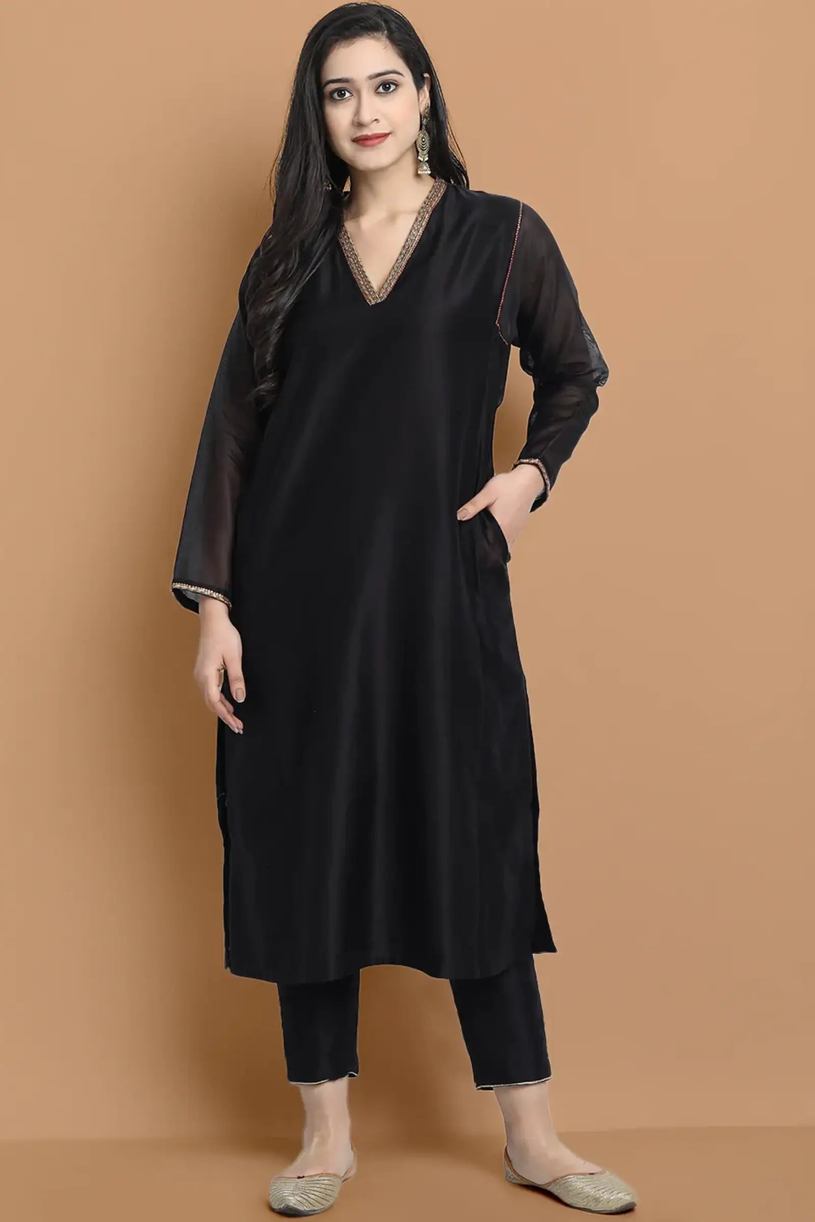 Yarn dyed chanderi kurta accentutated with hand embroidery at the neck area and armhole and cuff, paired with cotton pencil pant
