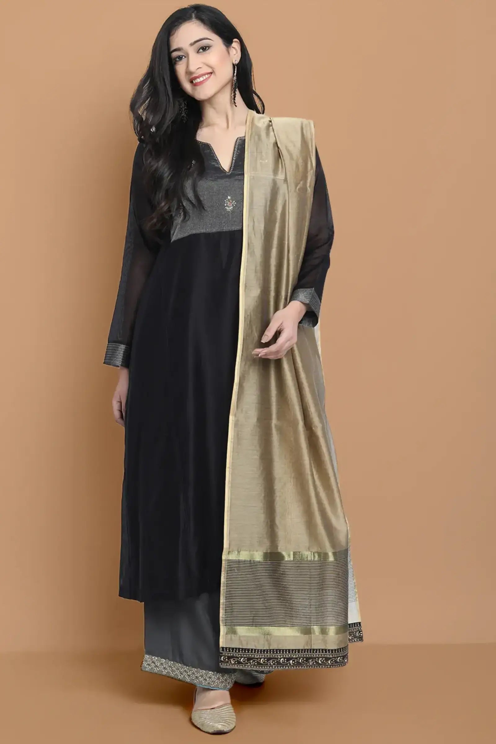 Black silk chanderi Dress Accentuated with Exquisite hand embroidery signifing beauty is in the detailing.