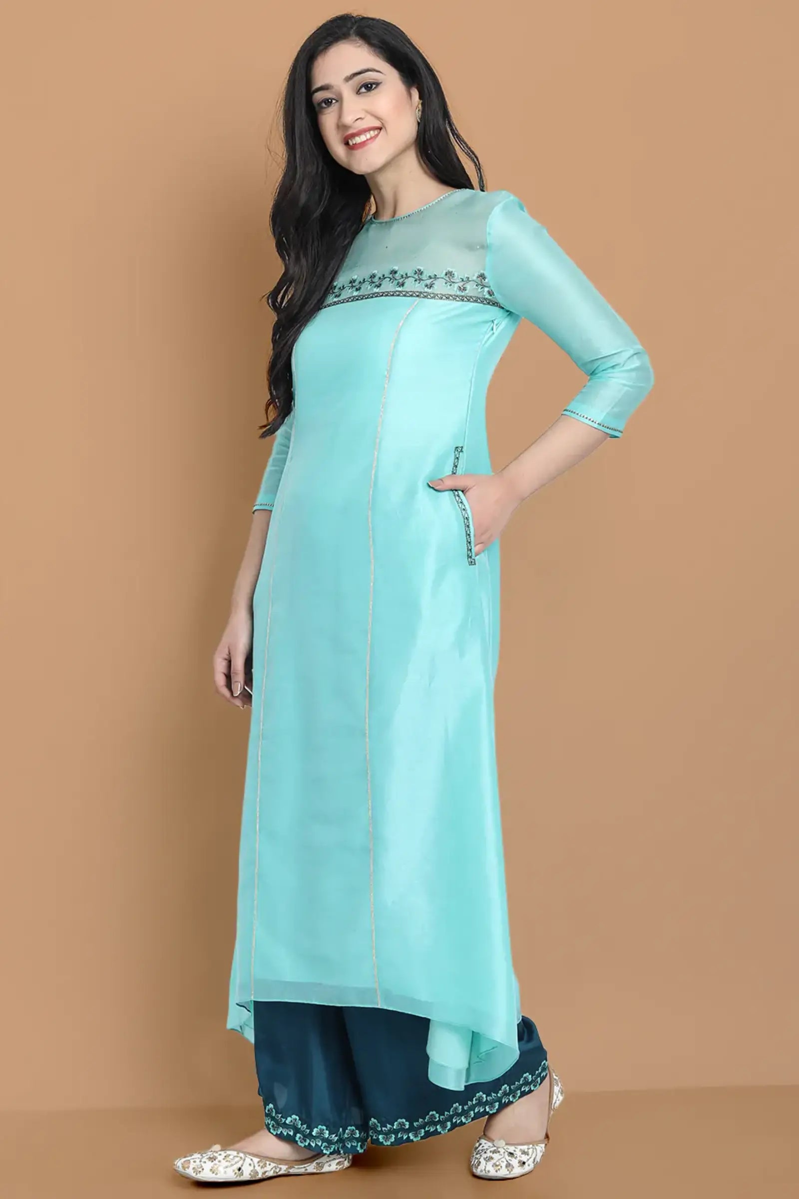 Pastel blue high low kurta with hand and machine embroidery , paired with embroidered wide farshi