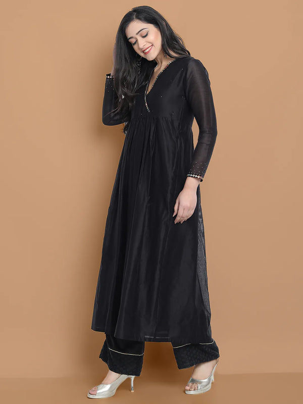 Black silk chanderi Dress Accentuated with Exquisite hand embroidery signifing beauty is in the detailing.