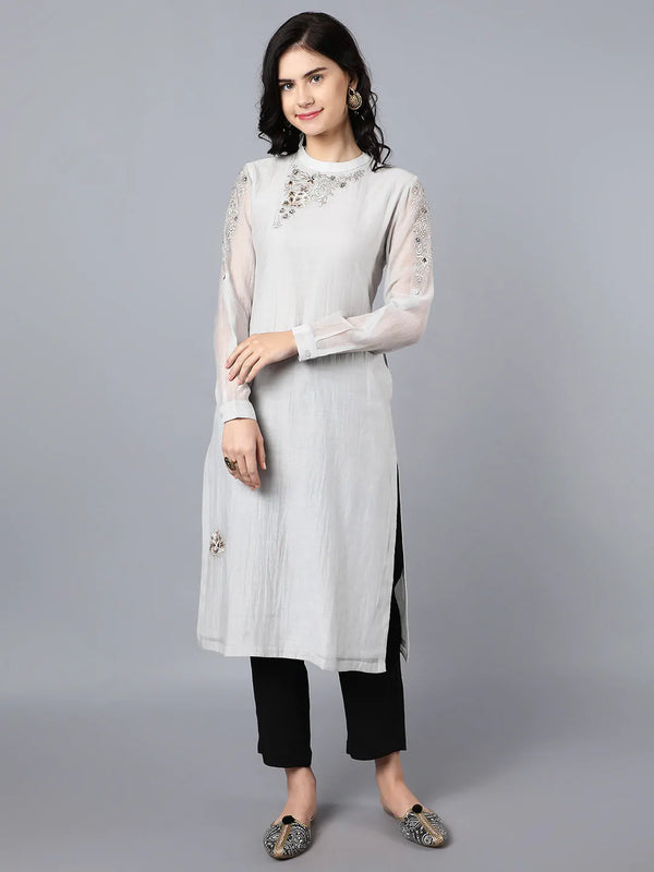 Chanderi kurta with resham and badla embroidery paired with chanderi pencil pants