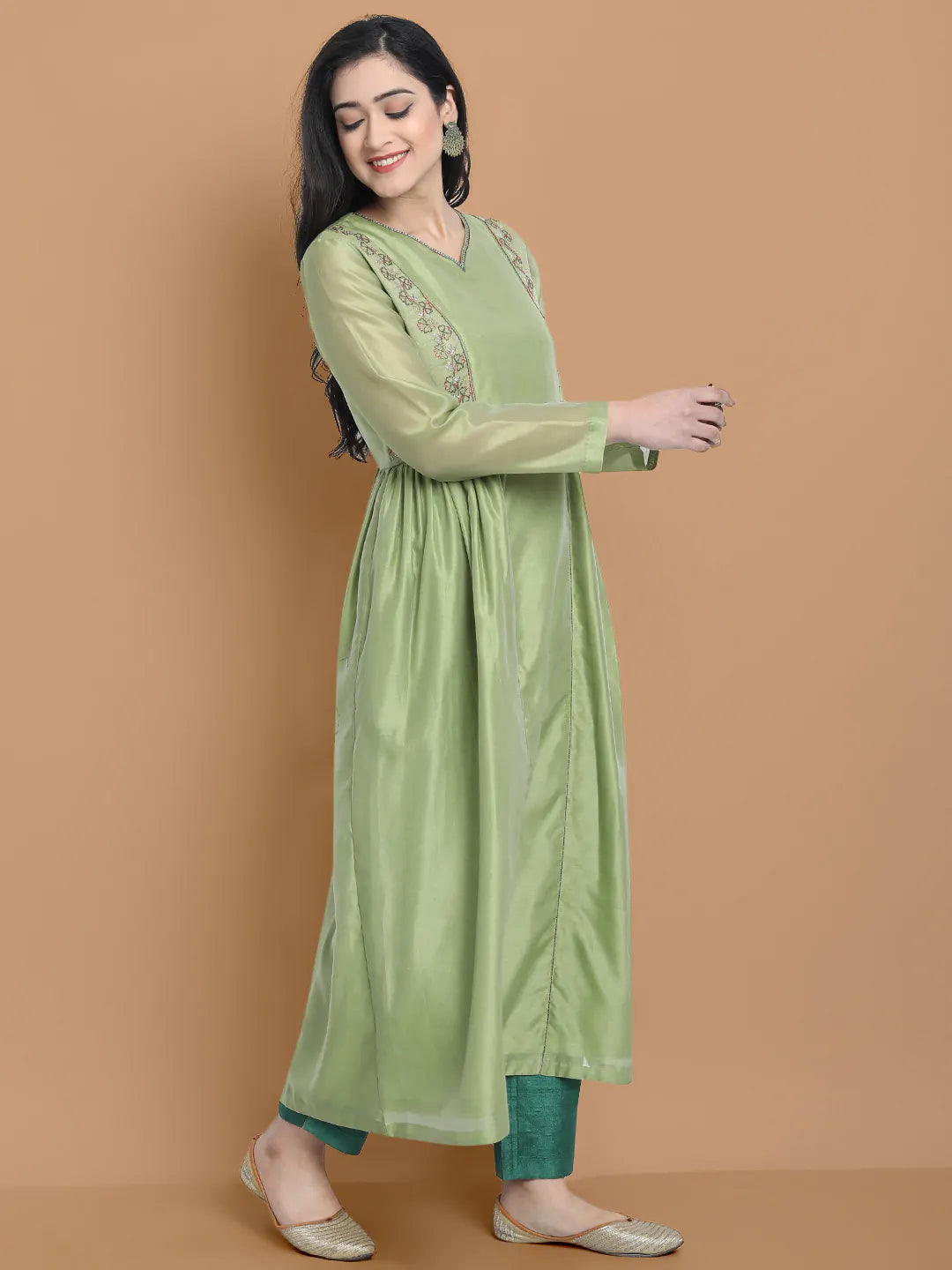 Light green silk chanderi kurta accentuated with exquisite hand embroidery and got emb at the neck , paired with cotton trouser