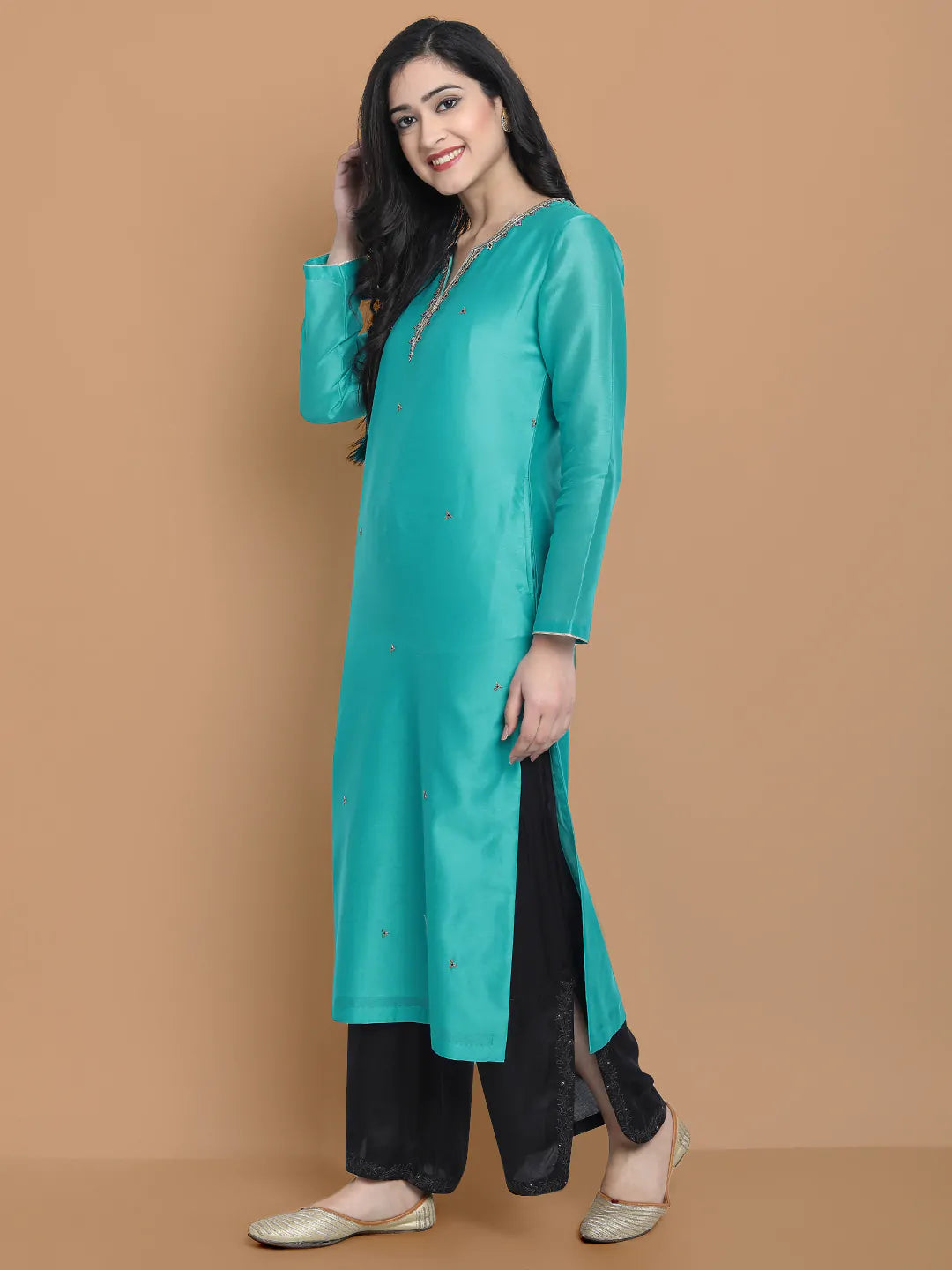 Royal blue silk chanderi kurta , accentuated with exquiste zari embroidery , mixture of hand and machine , sprinkled all over , paired with zari net dupata and modal satin slit plazo