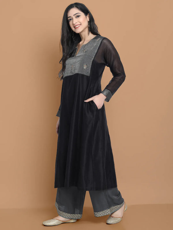 Black silk chanderi Dress Accentuated with Exquisite hand embroidery signifing beauty is in the detailing.
