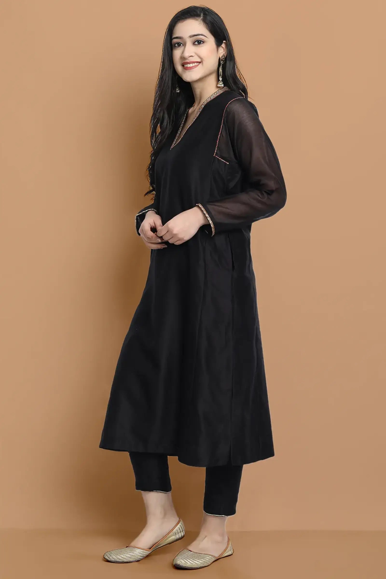 Yarn dyed chanderi kurta accentutated with hand embroidery at the neck area and armhole and cuff, paired with cotton pencil pant