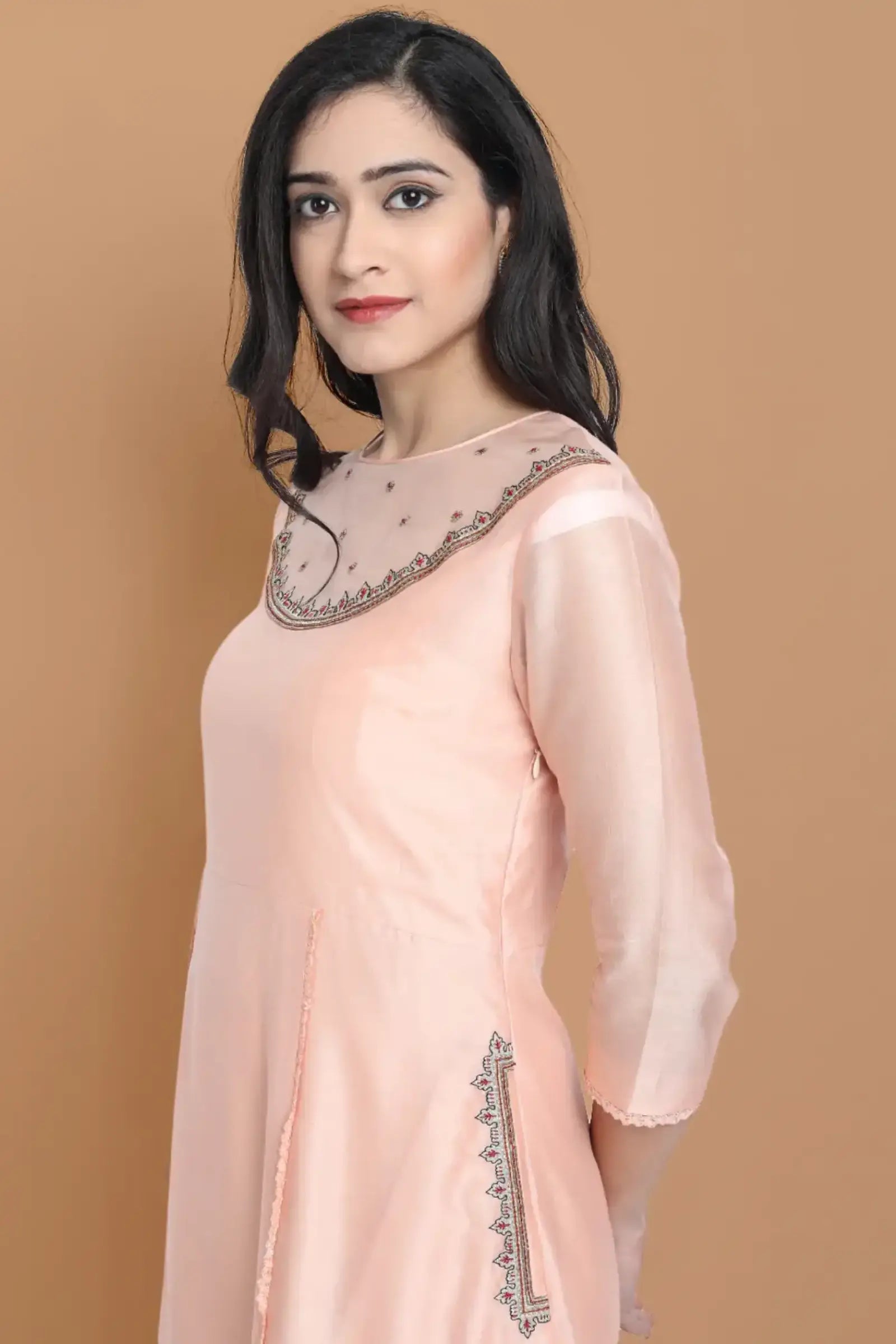 Yarn dyed chanderi kurta accentutated with hand machine embroidery on the textured shoulder yoke, paired with embroidered cotton trouser