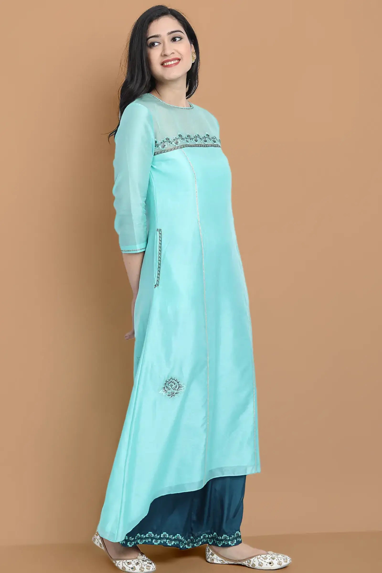 Pastel blue high low kurta with hand and machine embroidery , paired with embroidered wide farshi