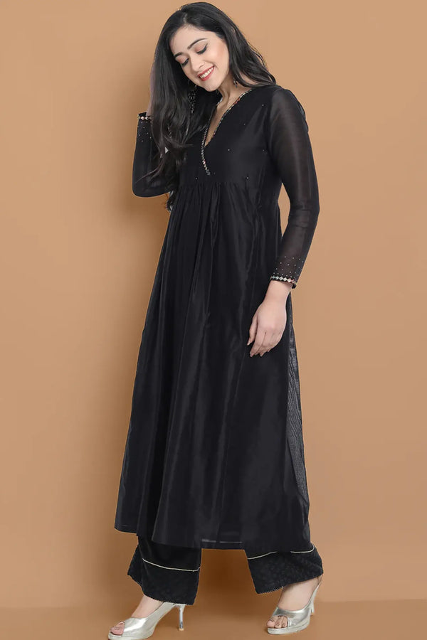 Black silk chanderi Dress Accentuated with Exquisite hand embroidery signifing beauty is in the detailing.