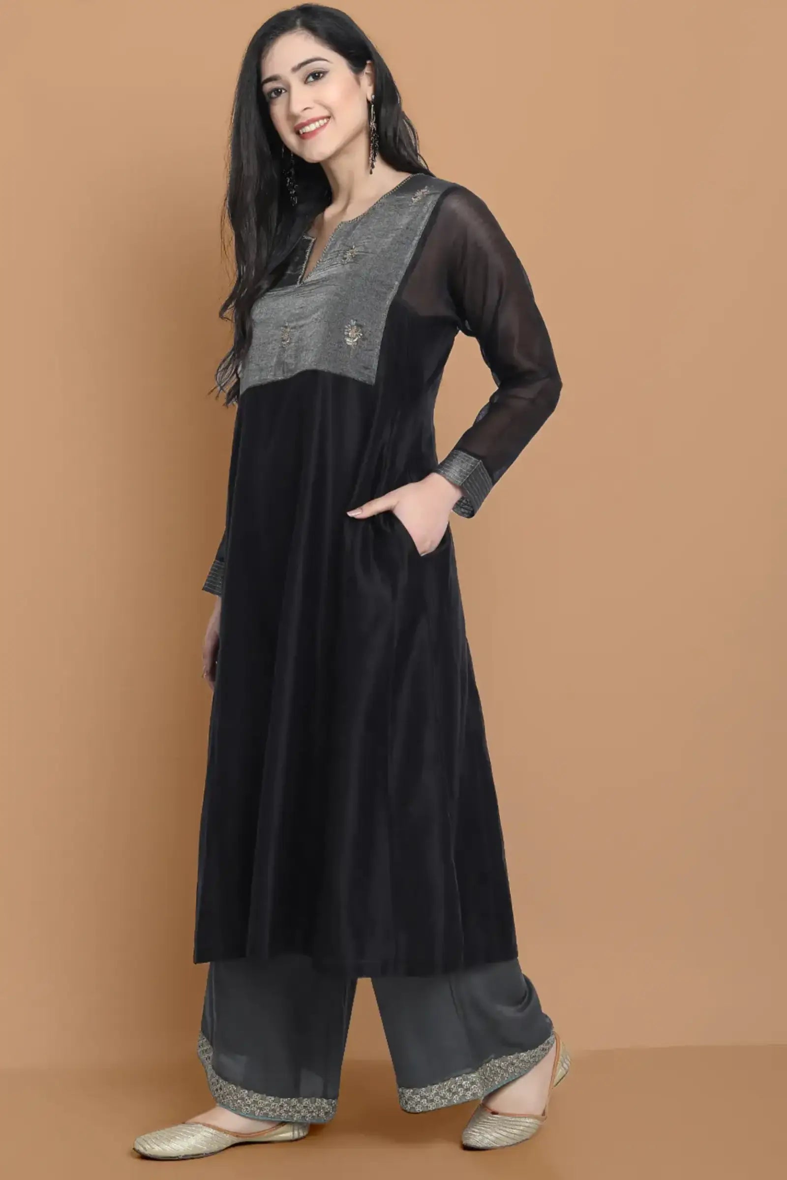 Black silk chanderi Dress Accentuated with Exquisite hand embroidery signifing beauty is in the detailing.