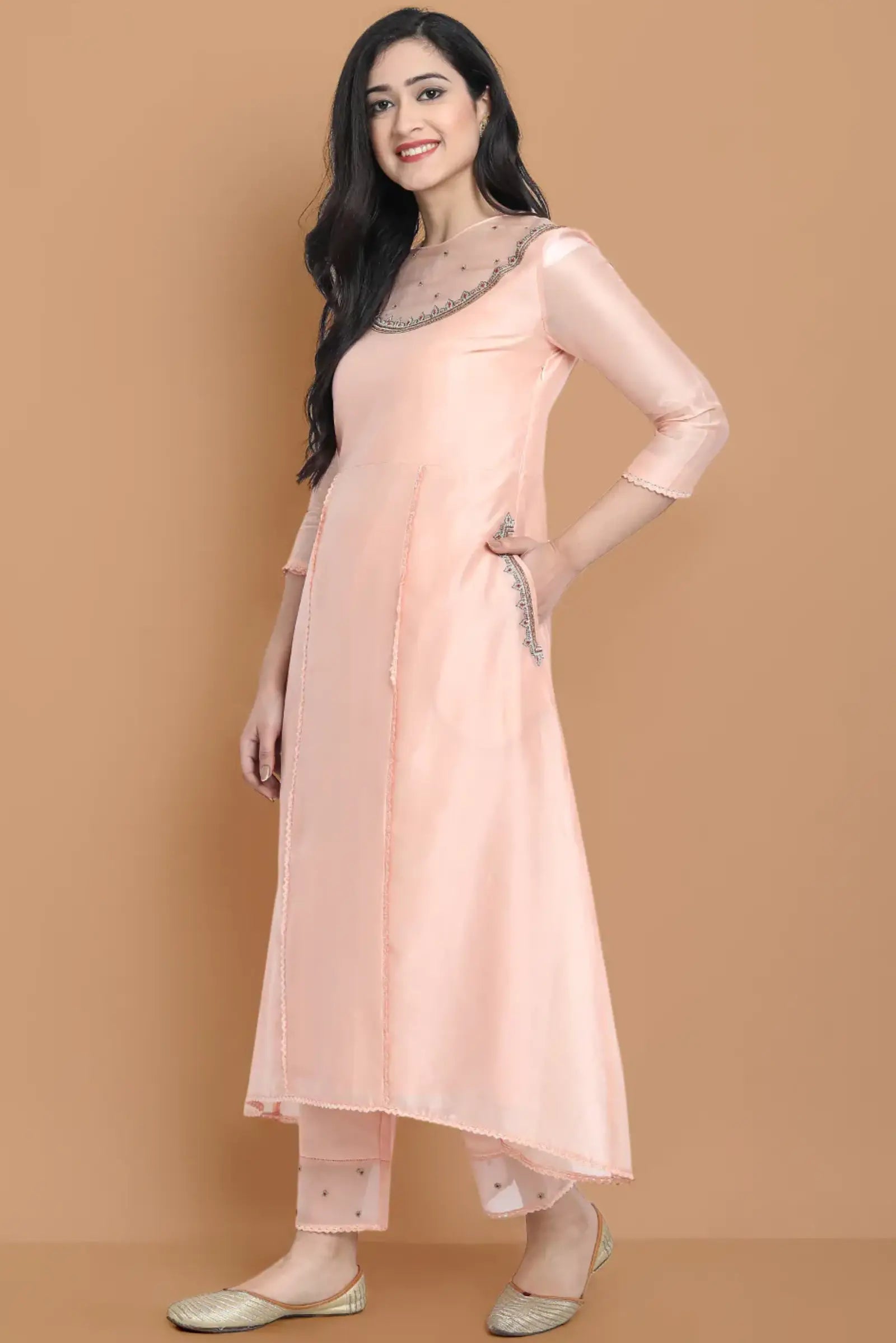 Yarn dyed chanderi kurta accentutated with hand machine embroidery on the textured shoulder yoke, paired with embroidered cotton trouser