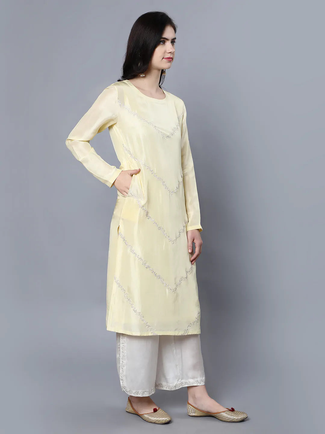 Cupro Silk Kurta with resham embroidery on front panel Paired with Ivory palazzo with embroidery at side slit covering hem