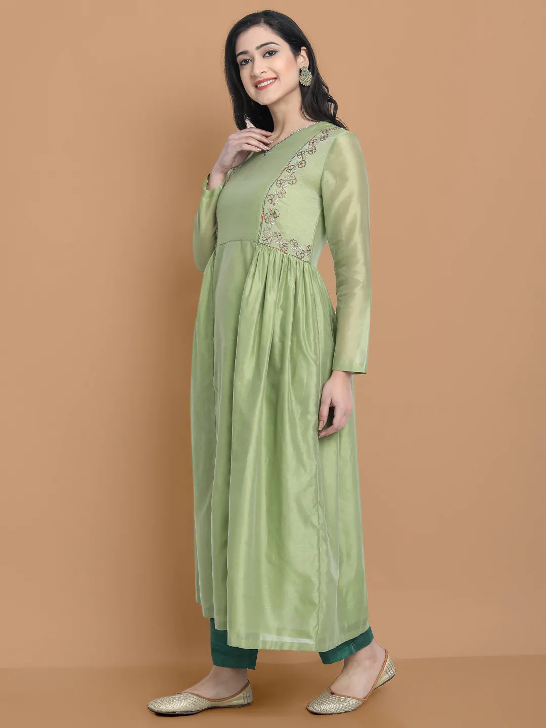 Light green silk chanderi kurta accentuated with exquisite hand embroidery and got emb at the neck , paired with cotton trouser