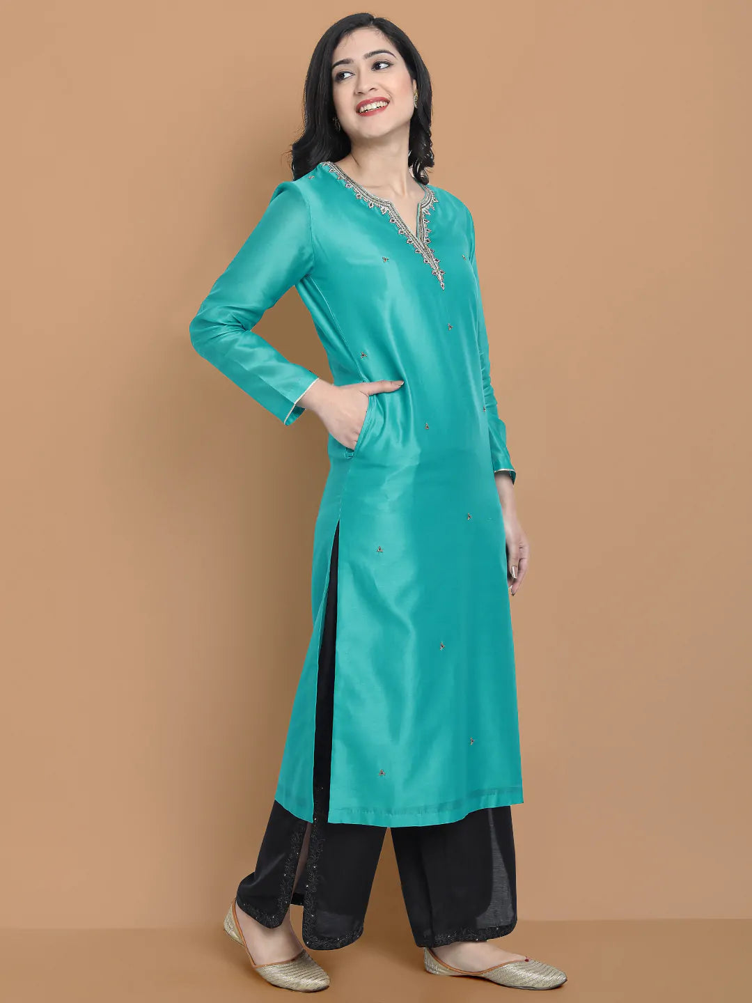 Royal blue silk chanderi kurta , accentuated with exquiste zari embroidery , mixture of hand and machine , sprinkled all over , paired with zari net dupata and modal satin slit plazo