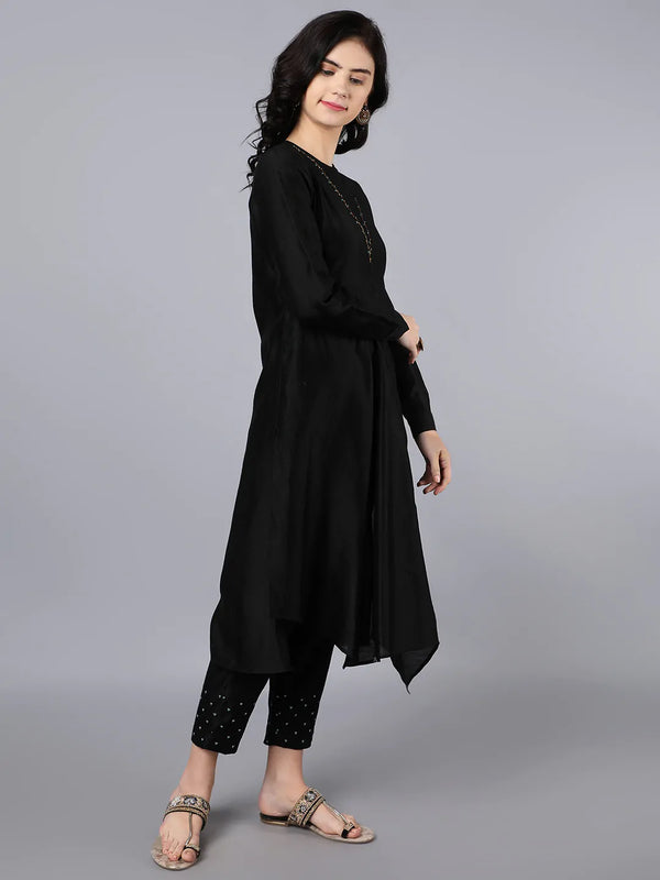 Chanderi Asymetric Kurta Black with hand embroidery on neck paired with pencil pants.