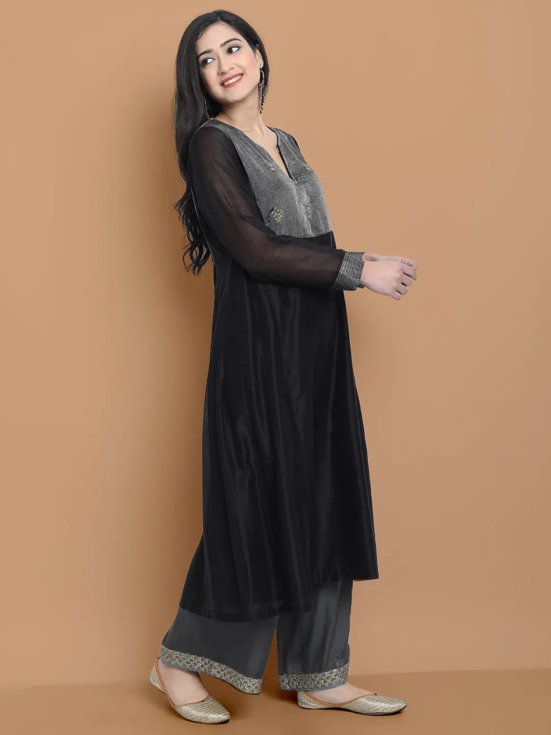Black silk chanderi Dress Accentuated with Exquisite hand embroidery signifing beauty is in the detailing.