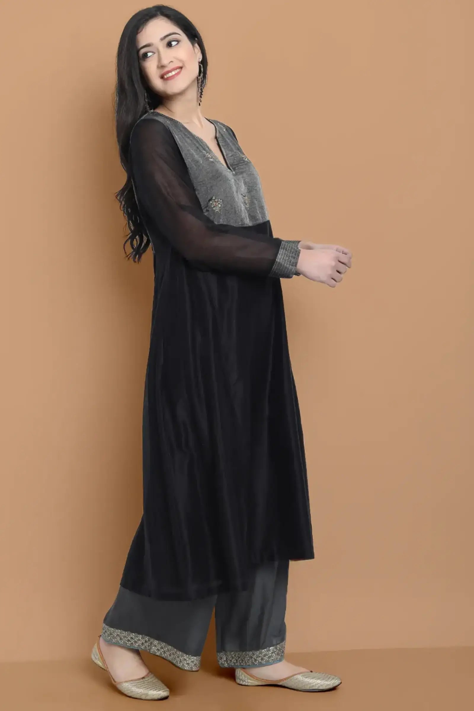 Black silk chanderi Dress Accentuated with Exquisite hand embroidery signifing beauty is in the detailing.