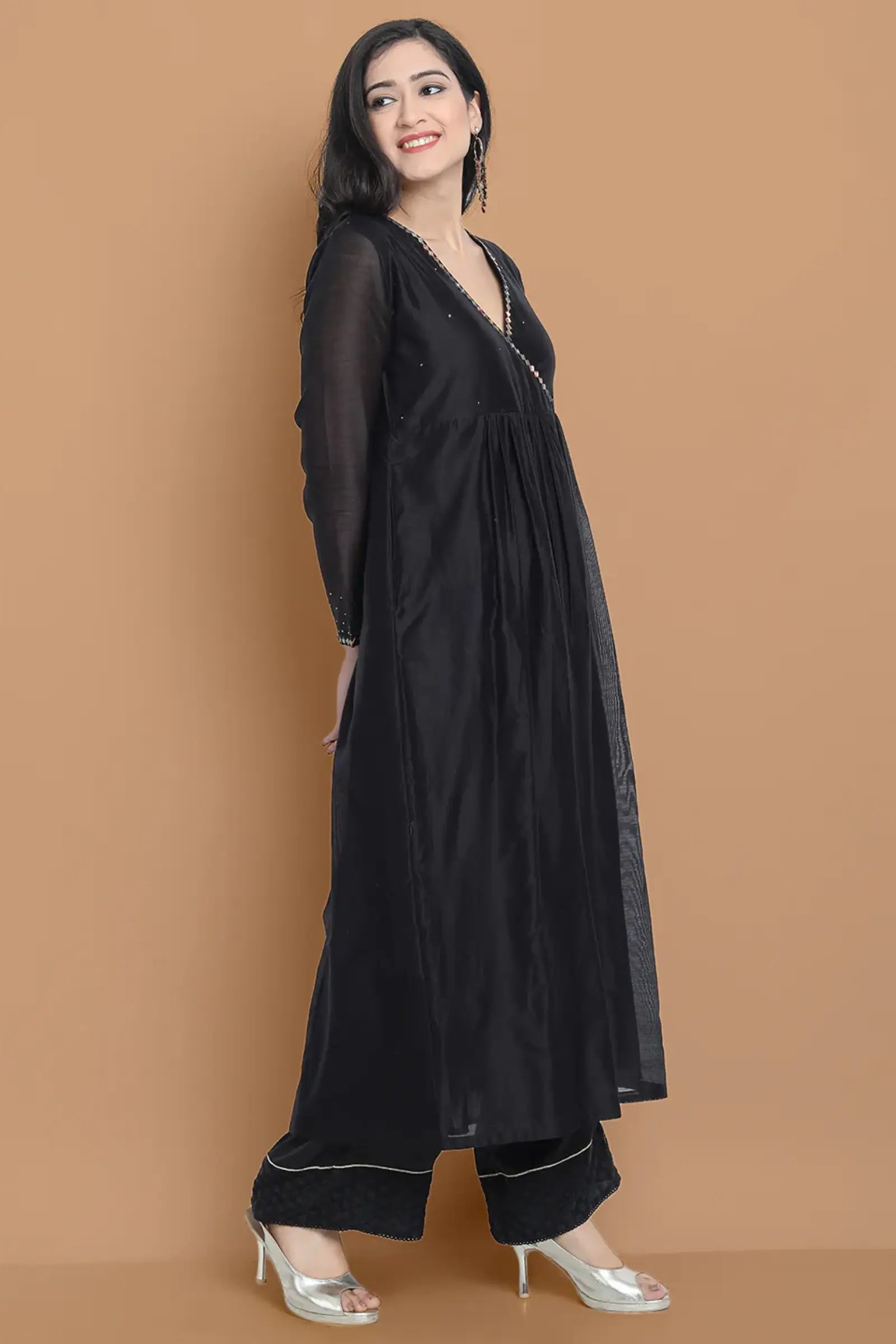 Black silk chanderi Dress Accentuated with Exquisite hand embroidery signifing beauty is in the detailing.