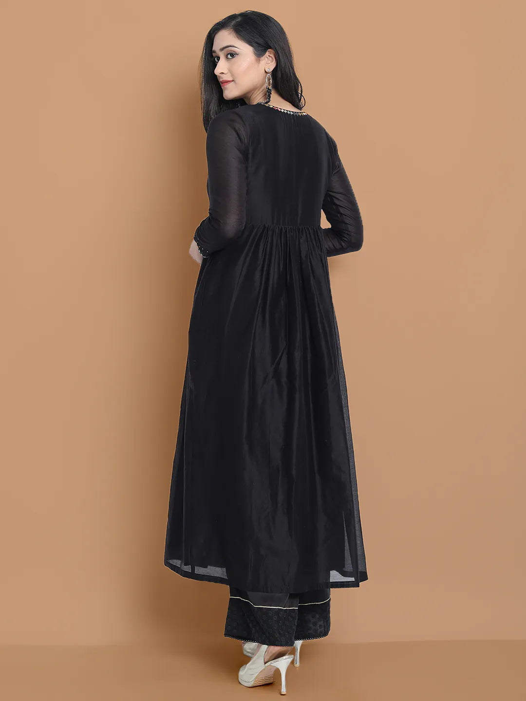 Black silk chanderi Dress Accentuated with Exquisite hand embroidery signifing beauty is in the detailing.