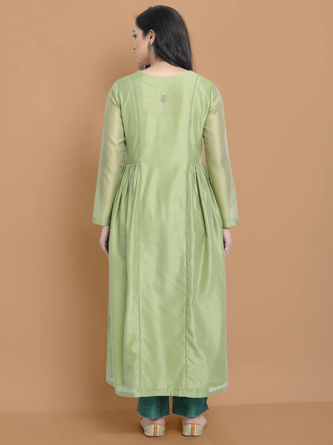 Light green silk chanderi kurta accentuated with exquisite hand embroidery and got emb at the neck , paired with cotton trouser