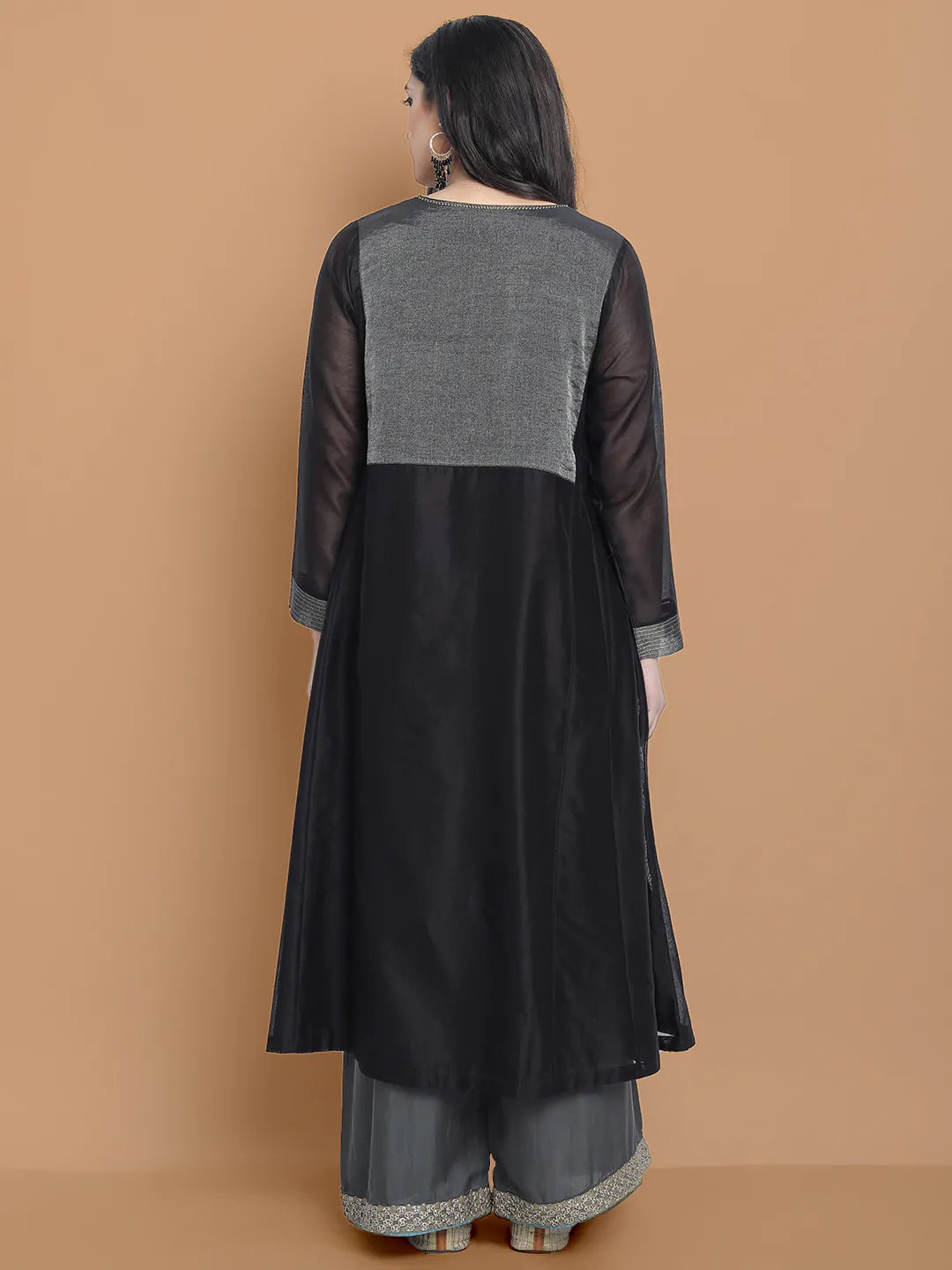 Black silk chanderi Dress Accentuated with Exquisite hand embroidery signifing beauty is in the detailing.