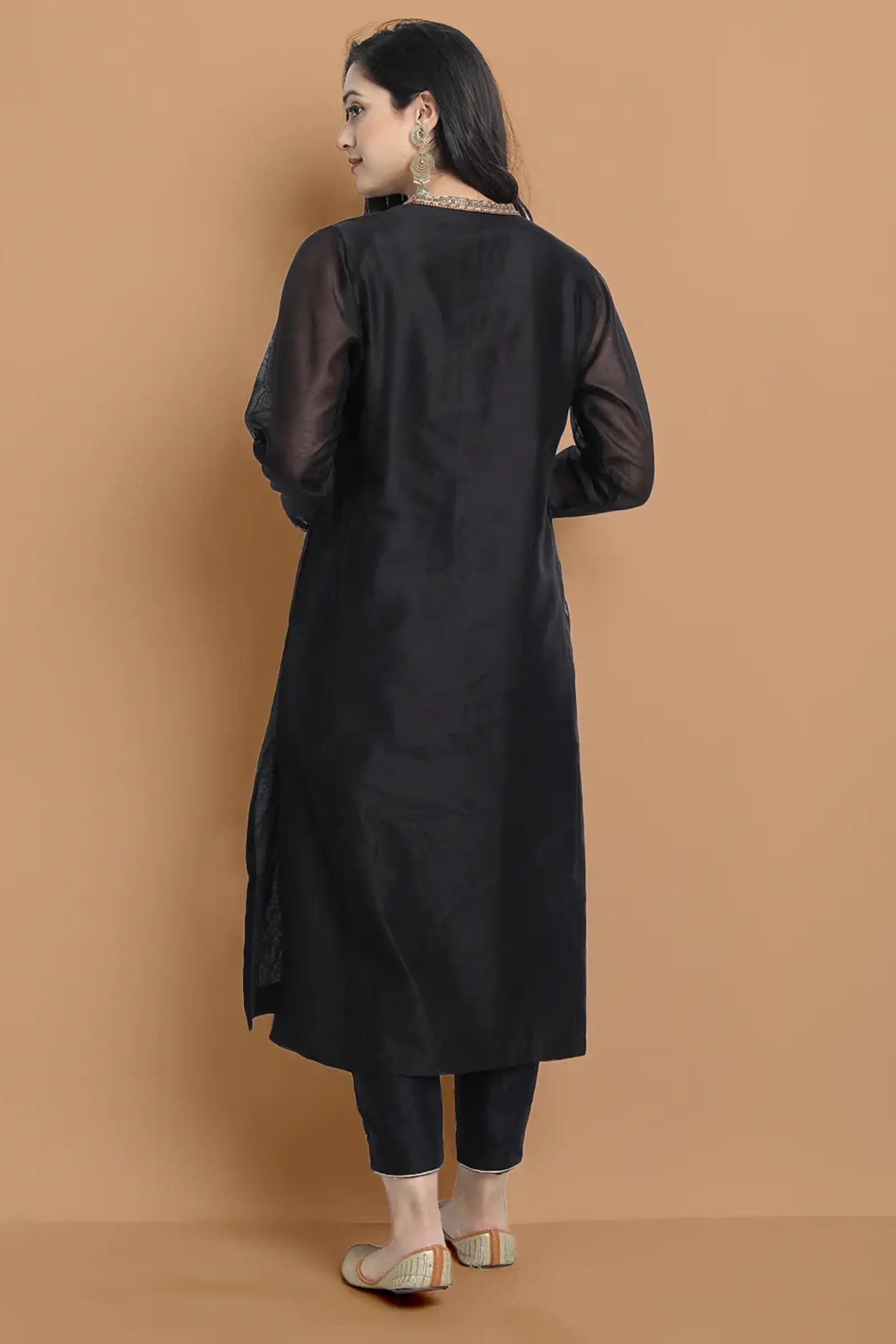 Yarn dyed chanderi kurta accentutated with hand embroidery at the neck area and armhole and cuff, paired with cotton pencil pant