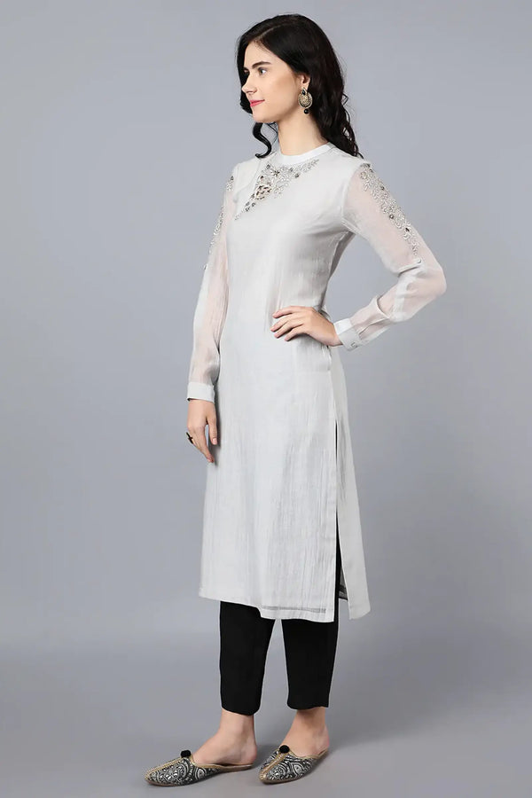 Chanderi kurta with resham and badla embroidery paired with chanderi pencil pants