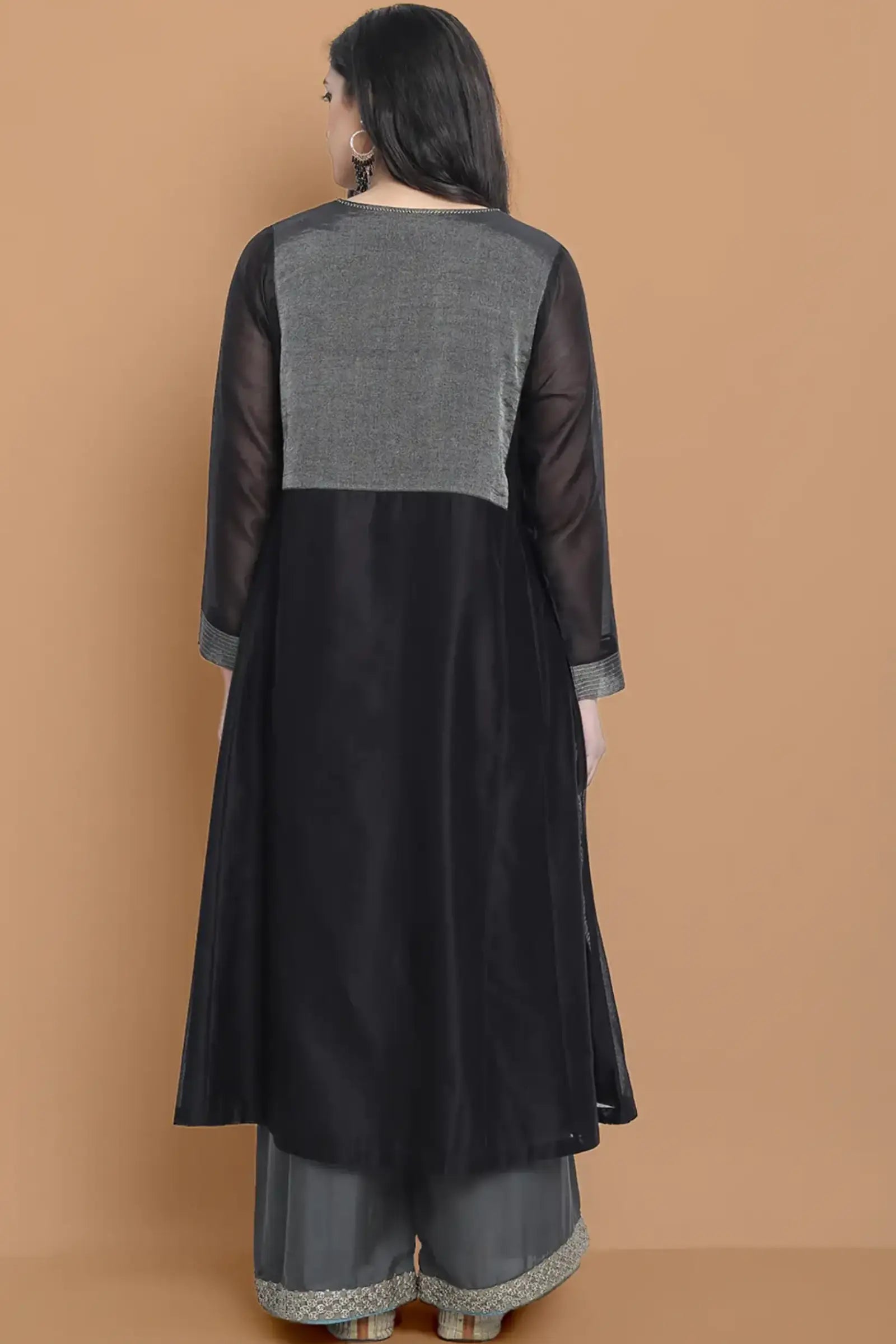 Black silk chanderi Dress Accentuated with Exquisite hand embroidery signifing beauty is in the detailing.