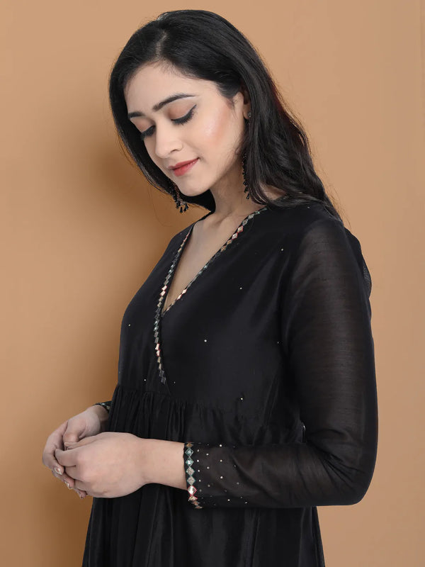 Black silk chanderi Dress Accentuated with Exquisite hand embroidery signifing beauty is in the detailing.
