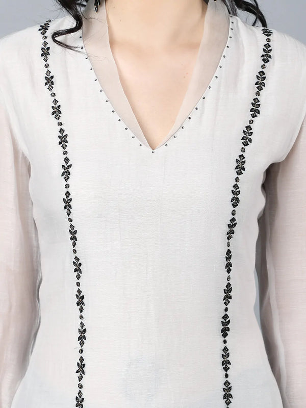 Chanderi kurta with resham and badla embroidery paired with farshi