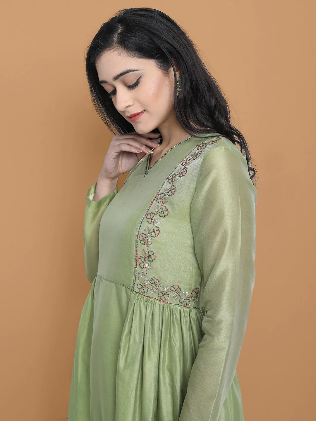 Light green silk chanderi kurta accentuated with exquisite hand embroidery and got emb at the neck , paired with cotton trouser