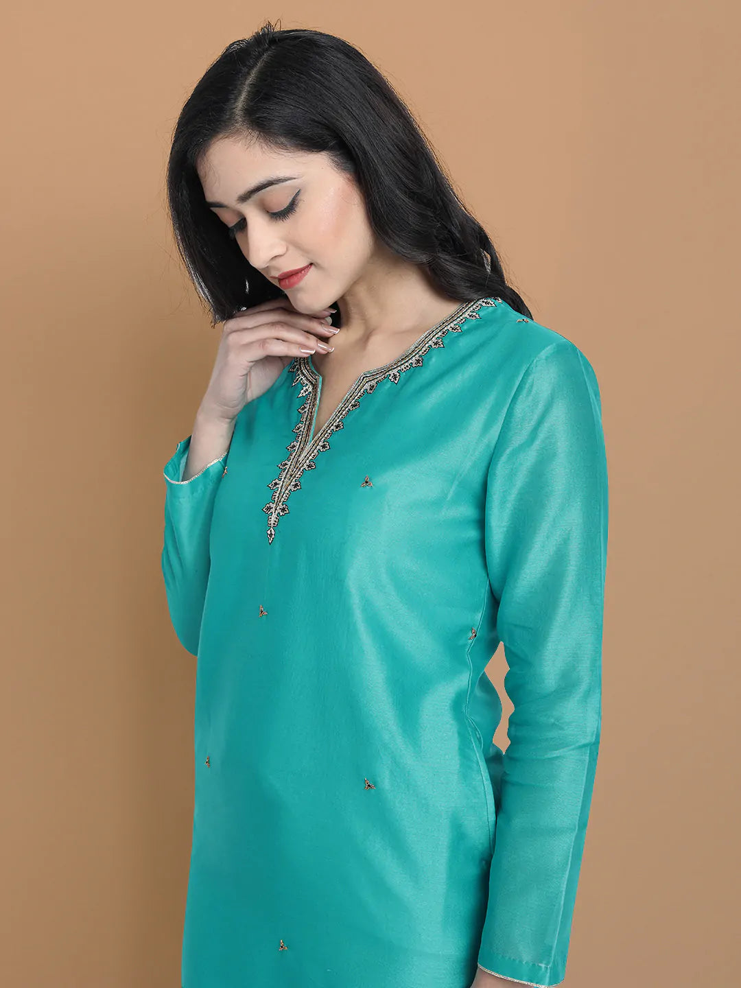 Royal blue silk chanderi kurta , accentuated with exquiste zari embroidery , mixture of hand and machine , sprinkled all over , paired with zari net dupata and modal satin slit plazo