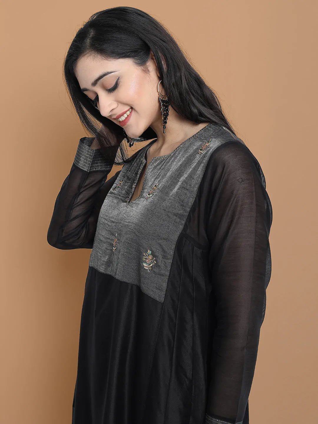 Black silk chanderi Dress Accentuated with Exquisite hand embroidery signifing beauty is in the detailing.