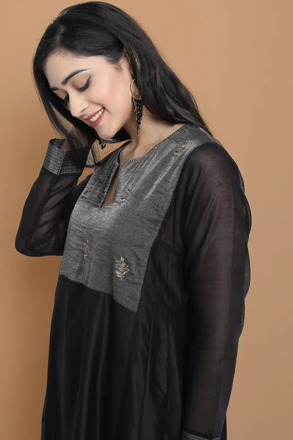 Black silk chanderi Dress Accentuated with Exquisite hand embroidery signifing beauty is in the detailing.