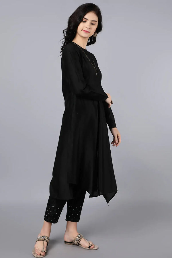 Chanderi Asymetric Kurta Black with hand embroidery on neck paired with pencil pants.