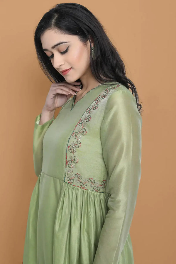 Light green silk chanderi kurta accentuated with exquisite hand embroidery and got emb at the neck , paired with cotton trouser