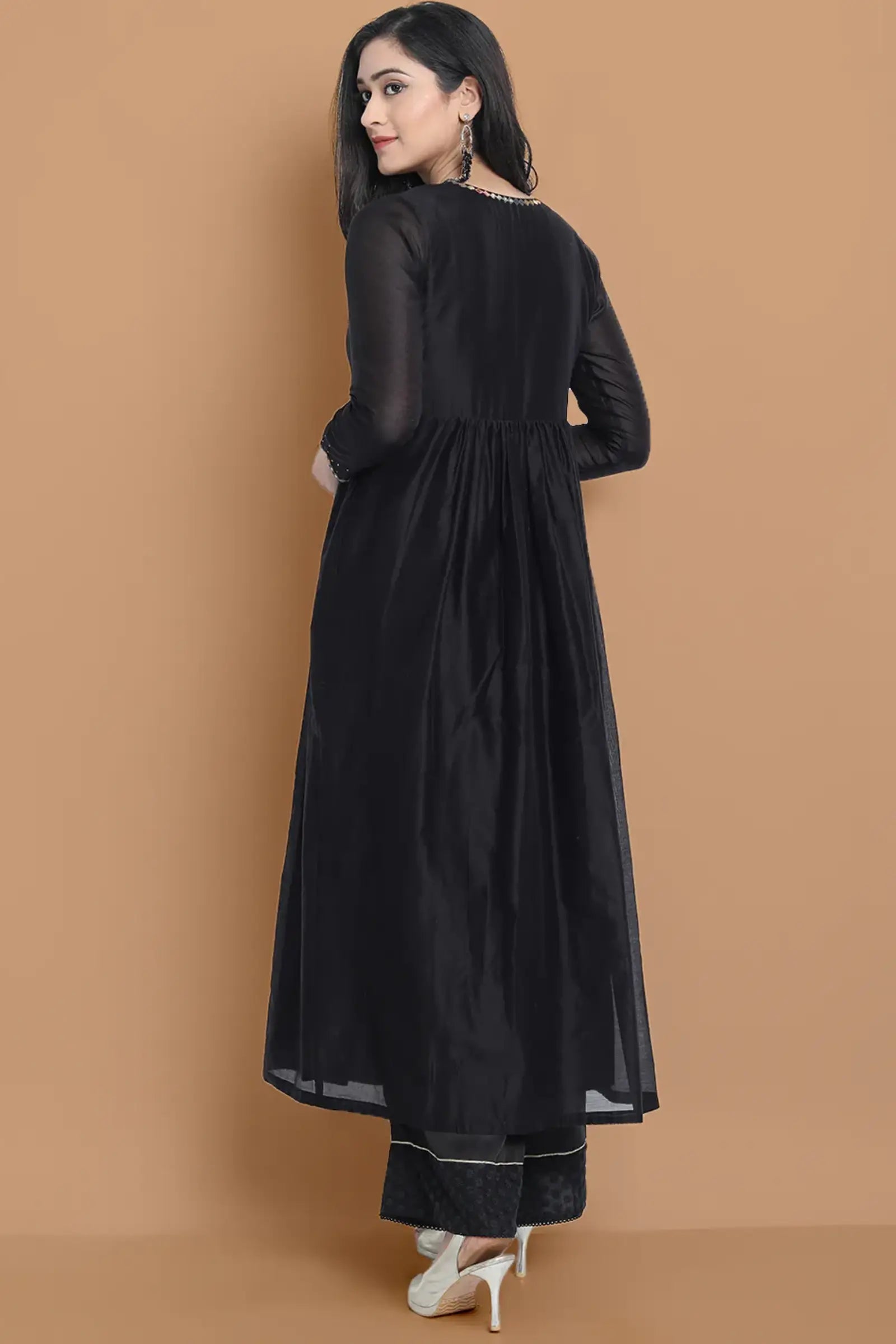 Black silk chanderi Dress Accentuated with Exquisite hand embroidery signifing beauty is in the detailing.