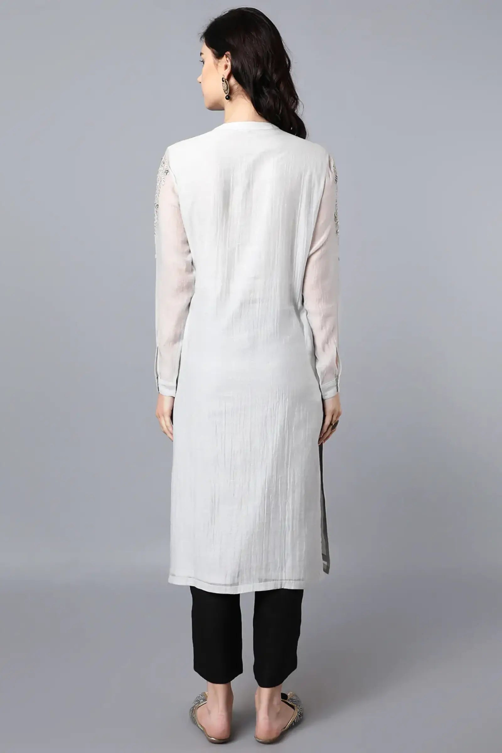 Chanderi kurta with resham and badla embroidery paired with chanderi pencil pants