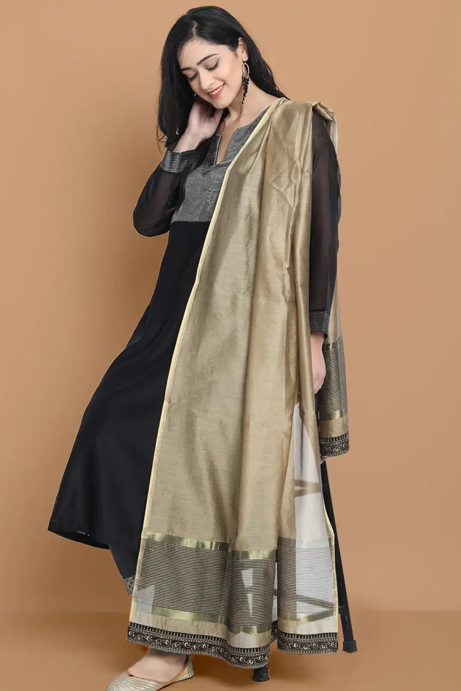 Black silk chanderi Dress Accentuated with Exquisite hand embroidery signifing beauty is in the detailing.