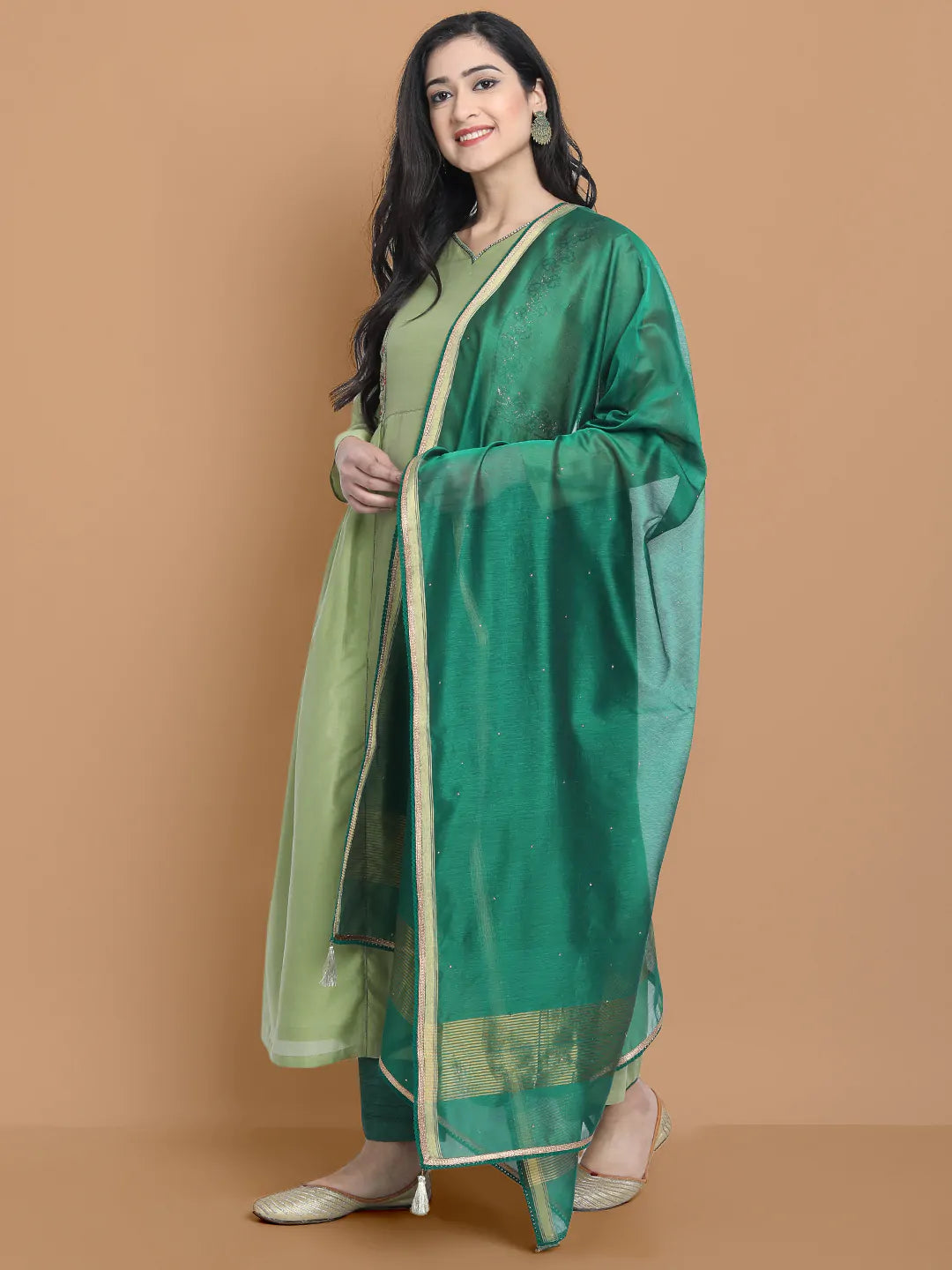 Light green silk chanderi kurta accentuated with exquisite hand embroidery and got emb at the neck , paired with cotton trouser